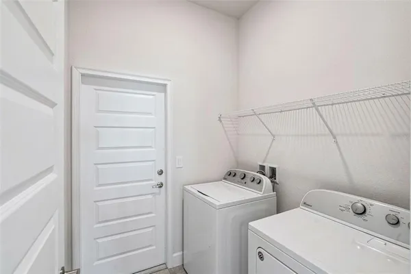 a utility room with dryer and washer