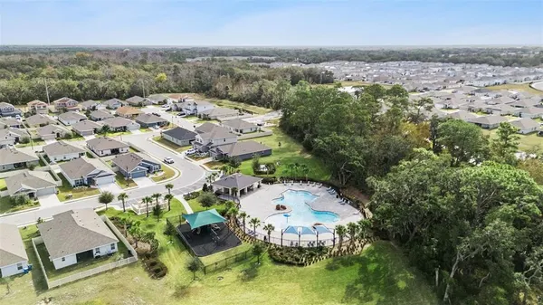 an aerial view of a house with a lake view