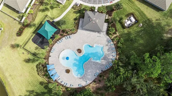 an aerial view of a house with outdoor space