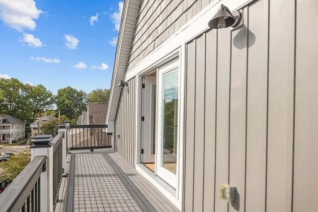 a view of a balcony with wooden floor