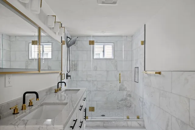 a bathroom with a sink and mirror