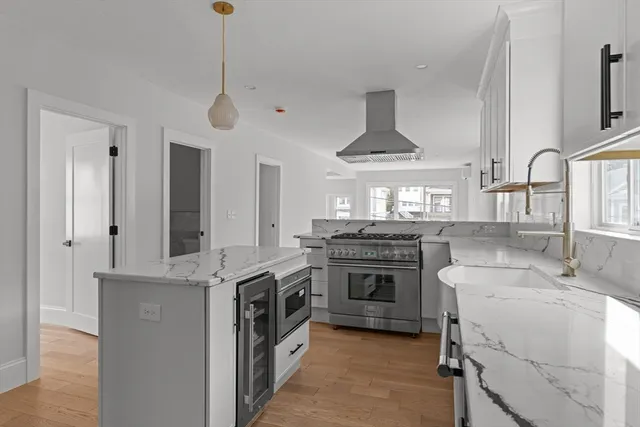 a kitchen with a stove and a sink