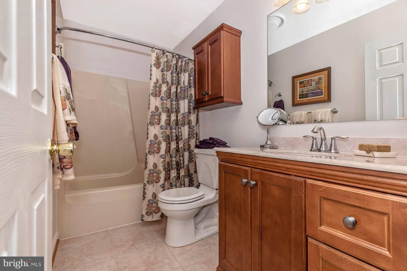 2404 Prentice Court Frederick, MD 21702 - Photo 18 of 33 Pretty hall bath with great cabinet space.