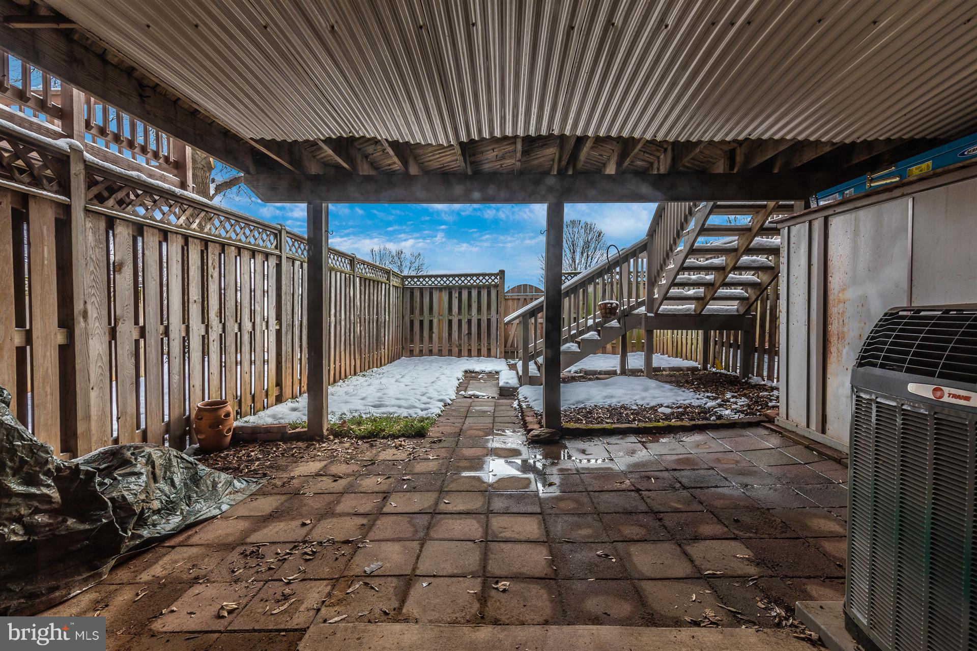 2404 Prentice Court Frederick, MD 21702 - Photo 22 of 33 Paver patio protected from weather by deck.