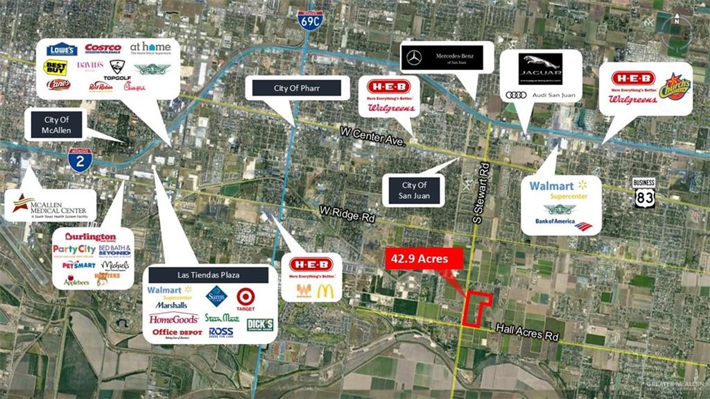 0 South Stewart Road San Juan, TX 78589 - Photo 2 of 14 a street sign on a brick wall with buildings and cars