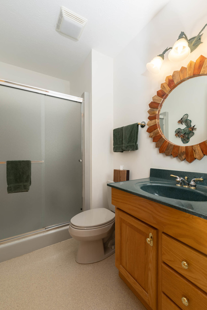 855 Breckenboro Road Lake Summerset, IL 61019 - Photo 15 of 31 a bathroom with a toilet a sink and mirror
