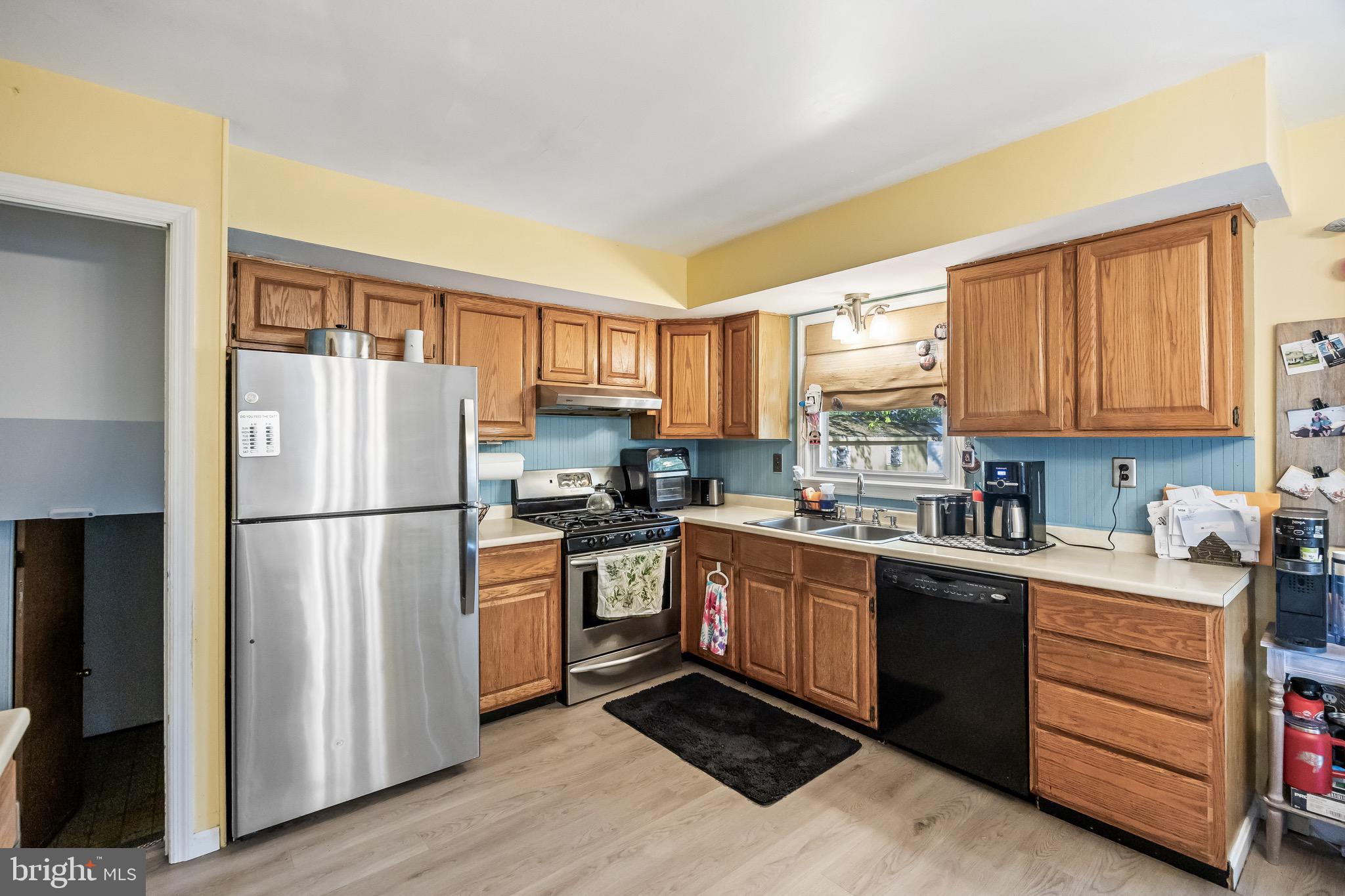 109 North Ambler Road Somers Point, NJ 08244 - Photo 12 of 22 a kitchen with stainless steel appliances granite countertop a refrigerator sink and stove