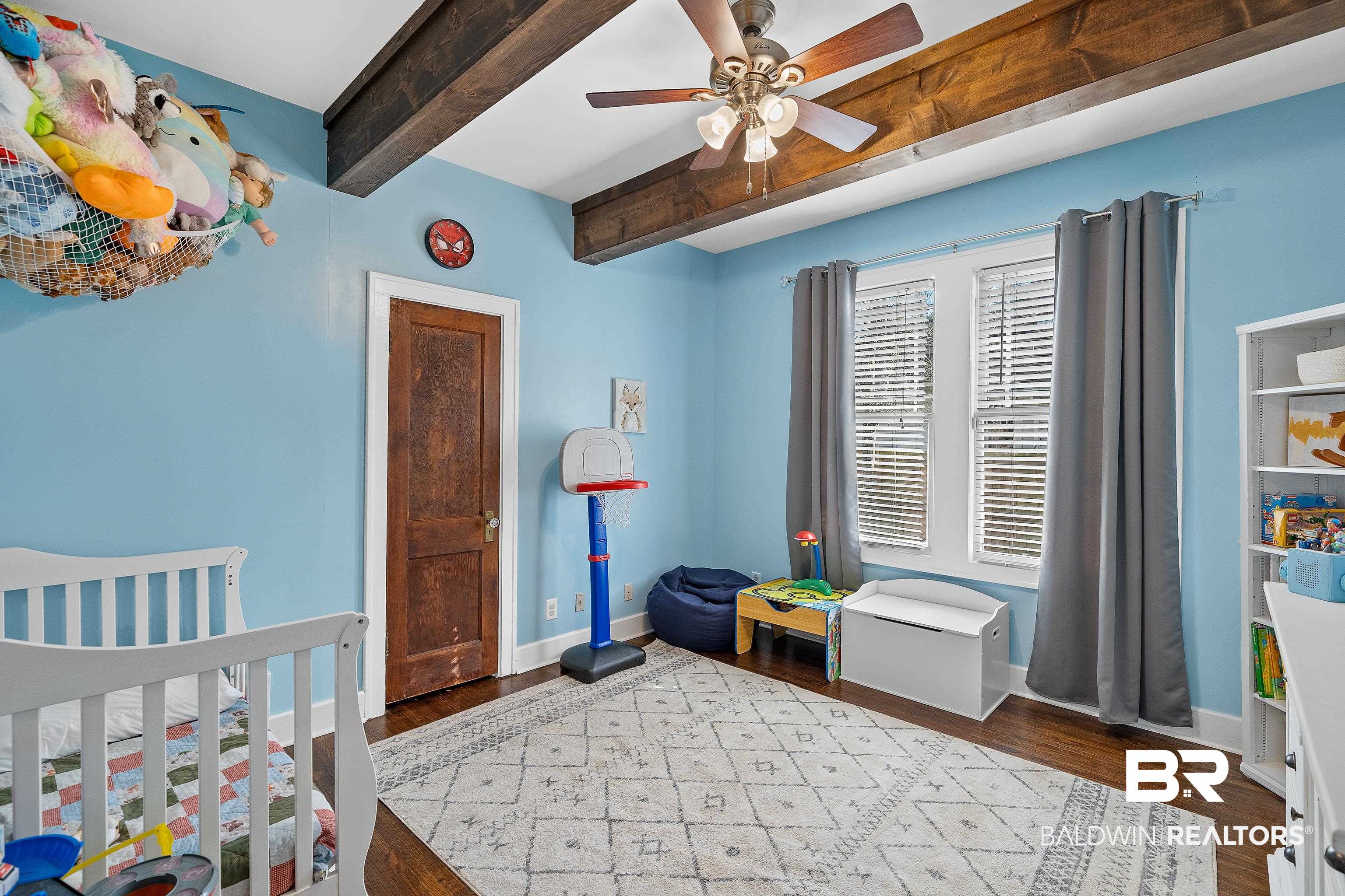 111 Macy Place Mobile, AL 36604 - Photo 18 of 35 This bedroom features beautiful beams on the ceiling along with beautiful hardwood floors.