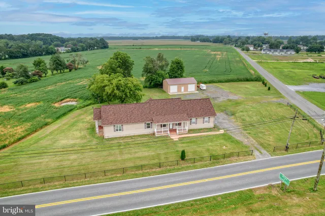 a view of a swimming pool and a yard