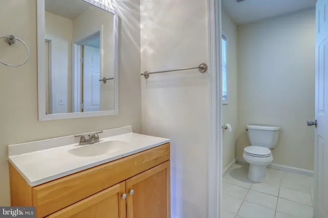 a bathroom with a sink toilet and vanity