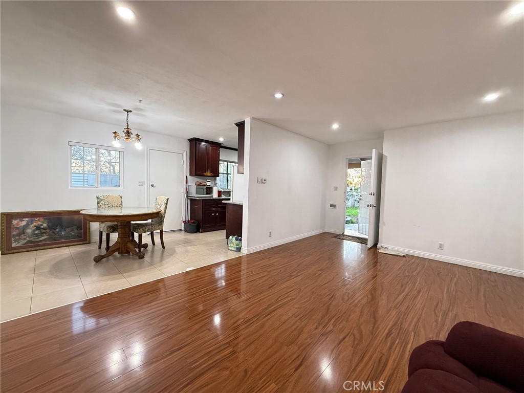 1427 South Rene Drive Santa Ana, CA 92704 - Photo 3 of 8 a view of kitchen with cabinets and wooden floor