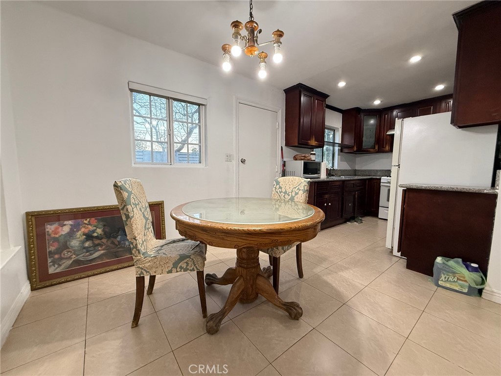 1427 South Rene Drive Santa Ana, CA 92704 - Photo 4 of 8 a view of kitchen with furniture and a chandelier