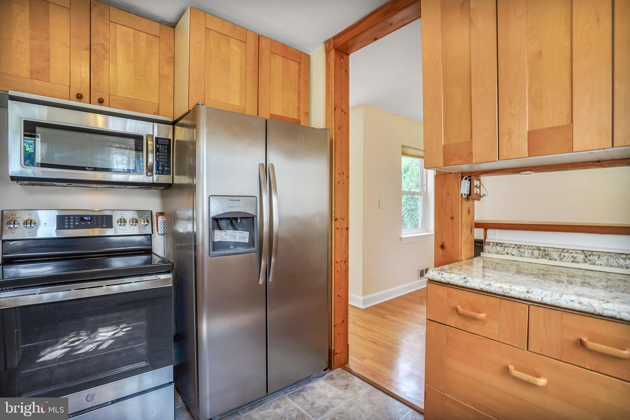 7110 Coventry Road Alexandria, VA 22306 - Photo 14 of 42 a kitchen with stainless steel appliances granite countertop a refrigerator and a stove top oven
