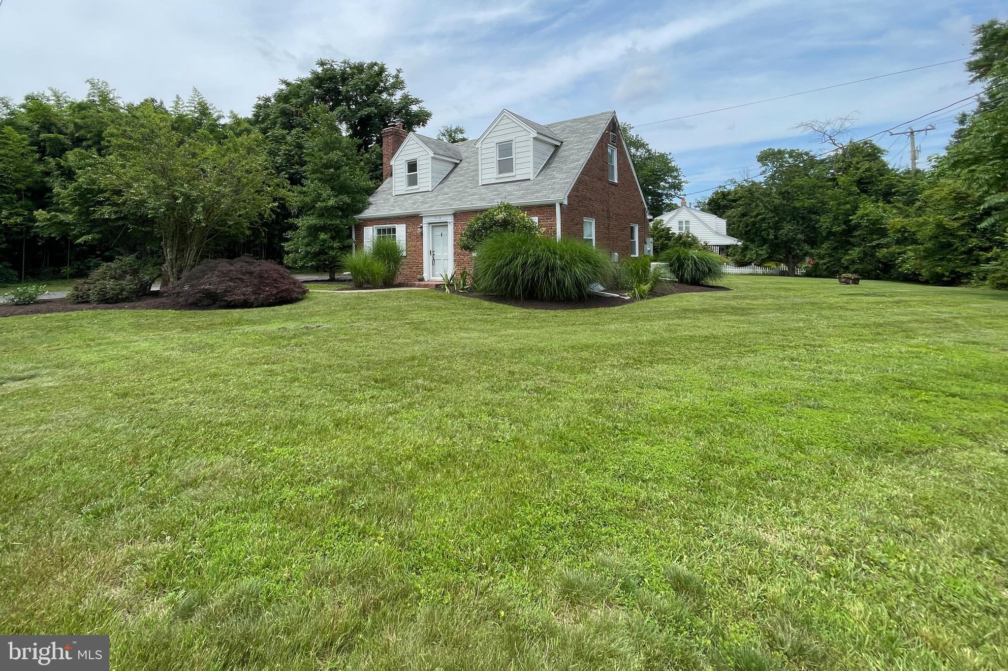 7110 Coventry Road Alexandria, VA 22306 - Photo 3 of 42 a front view of a house with a garden