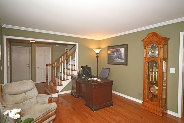 2110 Fairfax Road St. Charles, IL 60174 - Photo 5 of 20 a view of a livingroom with furniture stairs wooden floor and windows