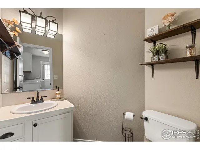a bathroom with a sink vanity and a mirror