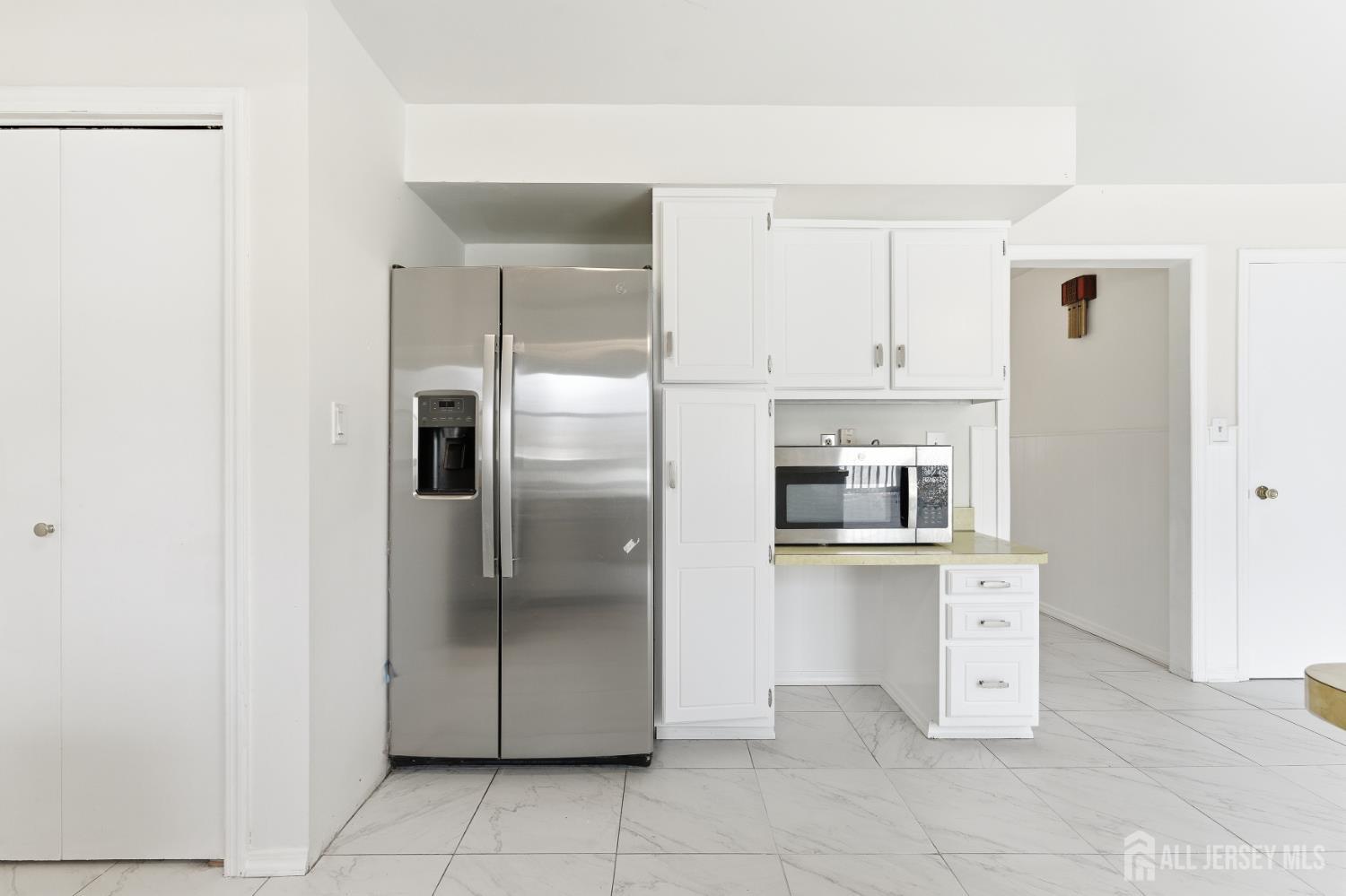 7 Oberlin Court Edison, NJ 08820 - Photo 14 of 40 a kitchen with stainless steel appliances granite countertop a refrigerator and a sink
