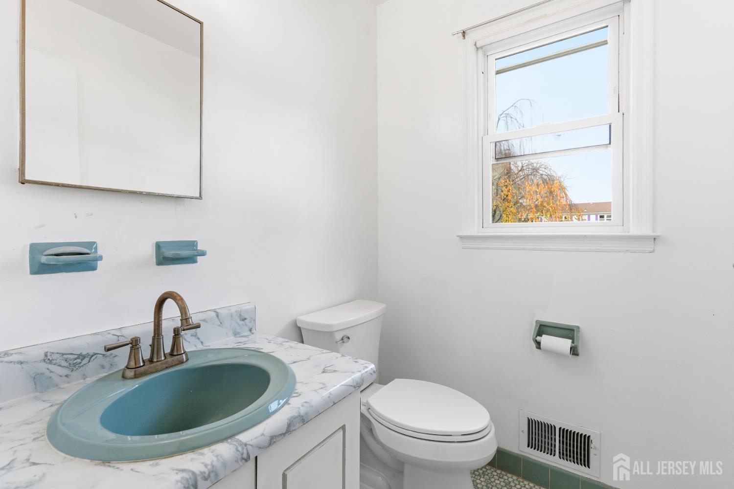 7 Oberlin Court Edison, NJ 08820 - Photo 18 of 40 a bathroom with a sink and a toilet