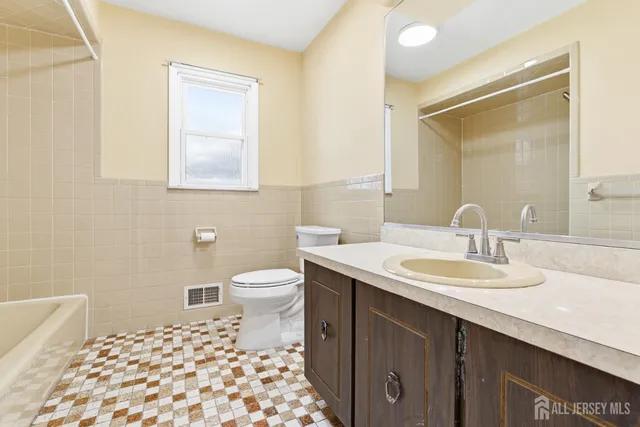 a bathroom with a sink and a toilet