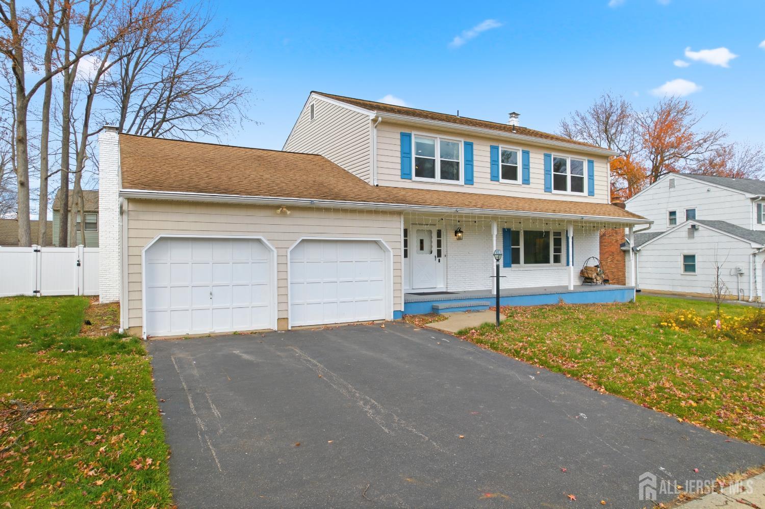 7 Oberlin Court Edison, NJ 08820 - Photo 3 of 40 a front view of a house with a yard and garage