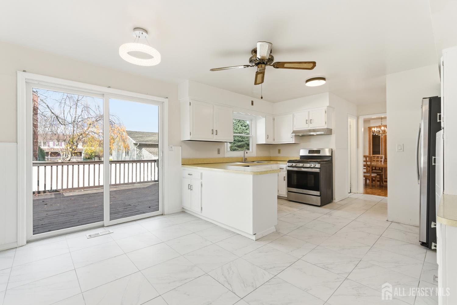 7 Oberlin Court Edison, NJ 08820 - Photo 10 of 40 a kitchen with stainless steel appliances a refrigerator sink and cabinets