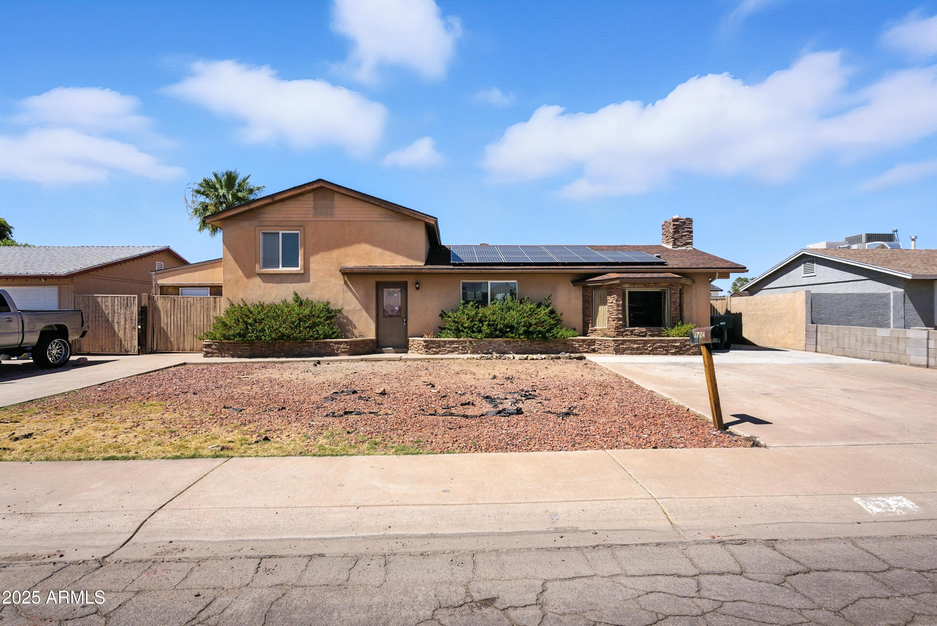 3724 West Bloomfield Road Phoenix, AZ 85029 - Photo 1 of 32 a front view of a house with a yard and garage
