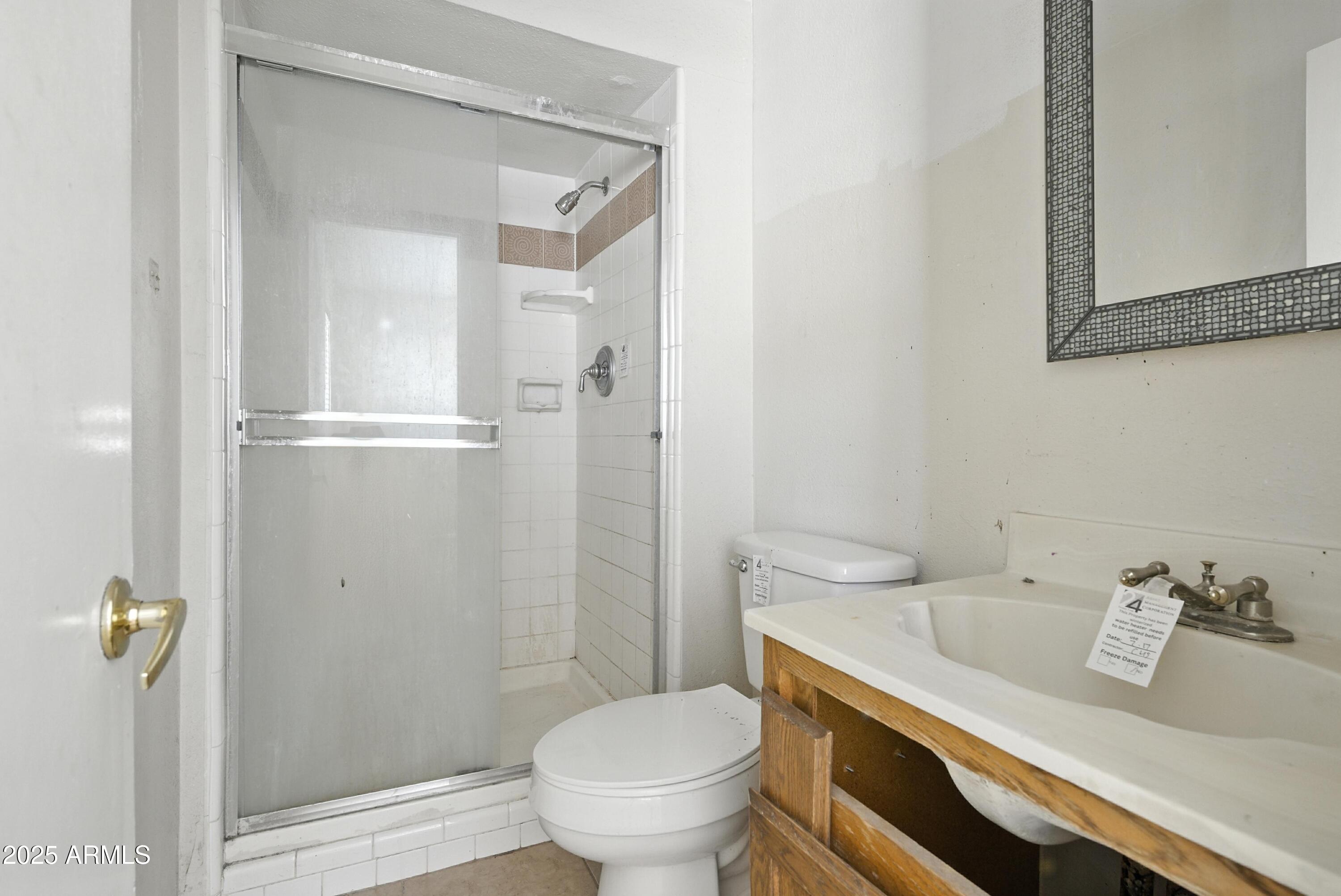3724 West Bloomfield Road Phoenix, AZ 85029 - Photo 18 of 32 a bathroom with a granite countertop sink toilet and shower