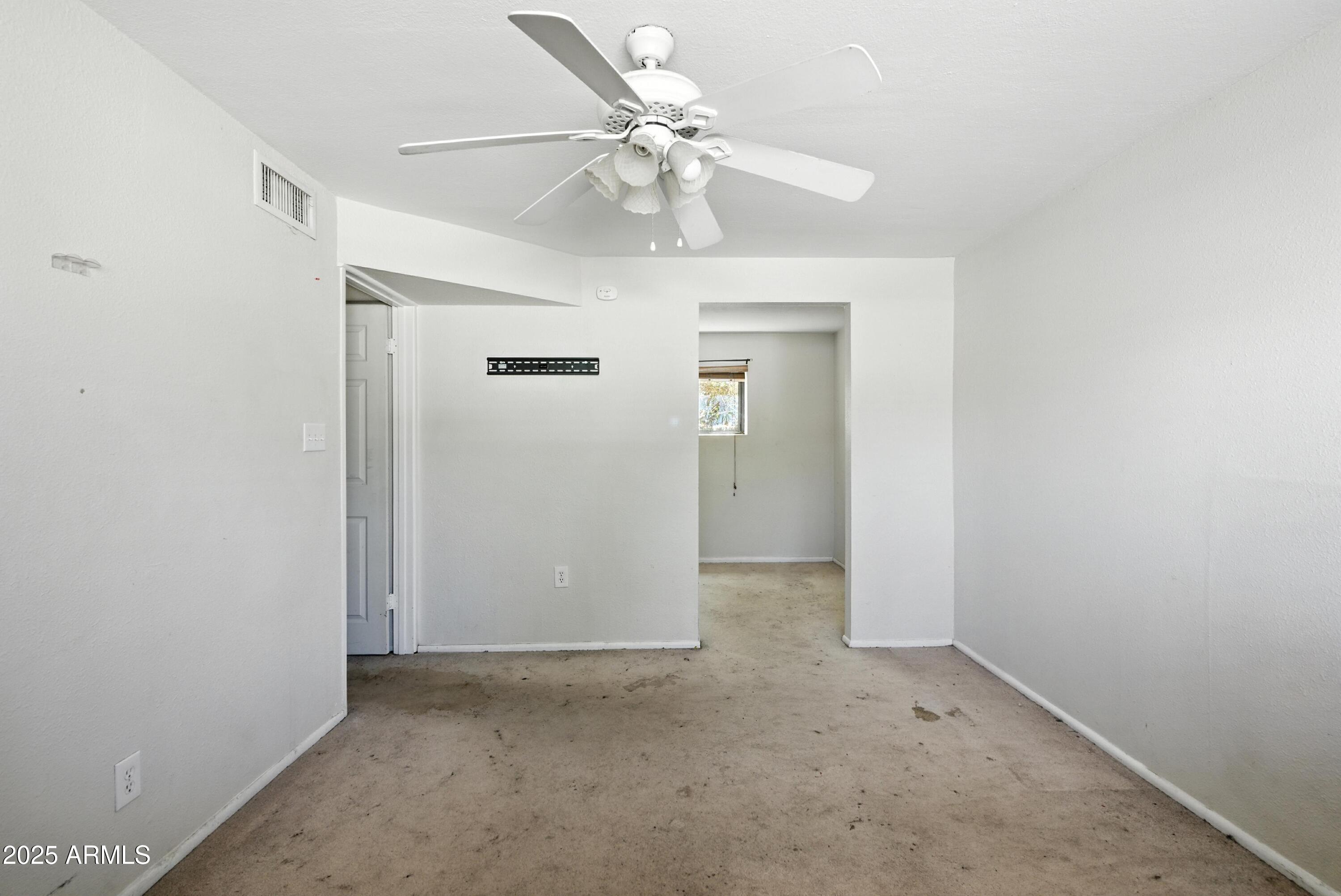 3724 West Bloomfield Road Phoenix, AZ 85029 - Photo 19 of 32 an empty room with fan and entrance