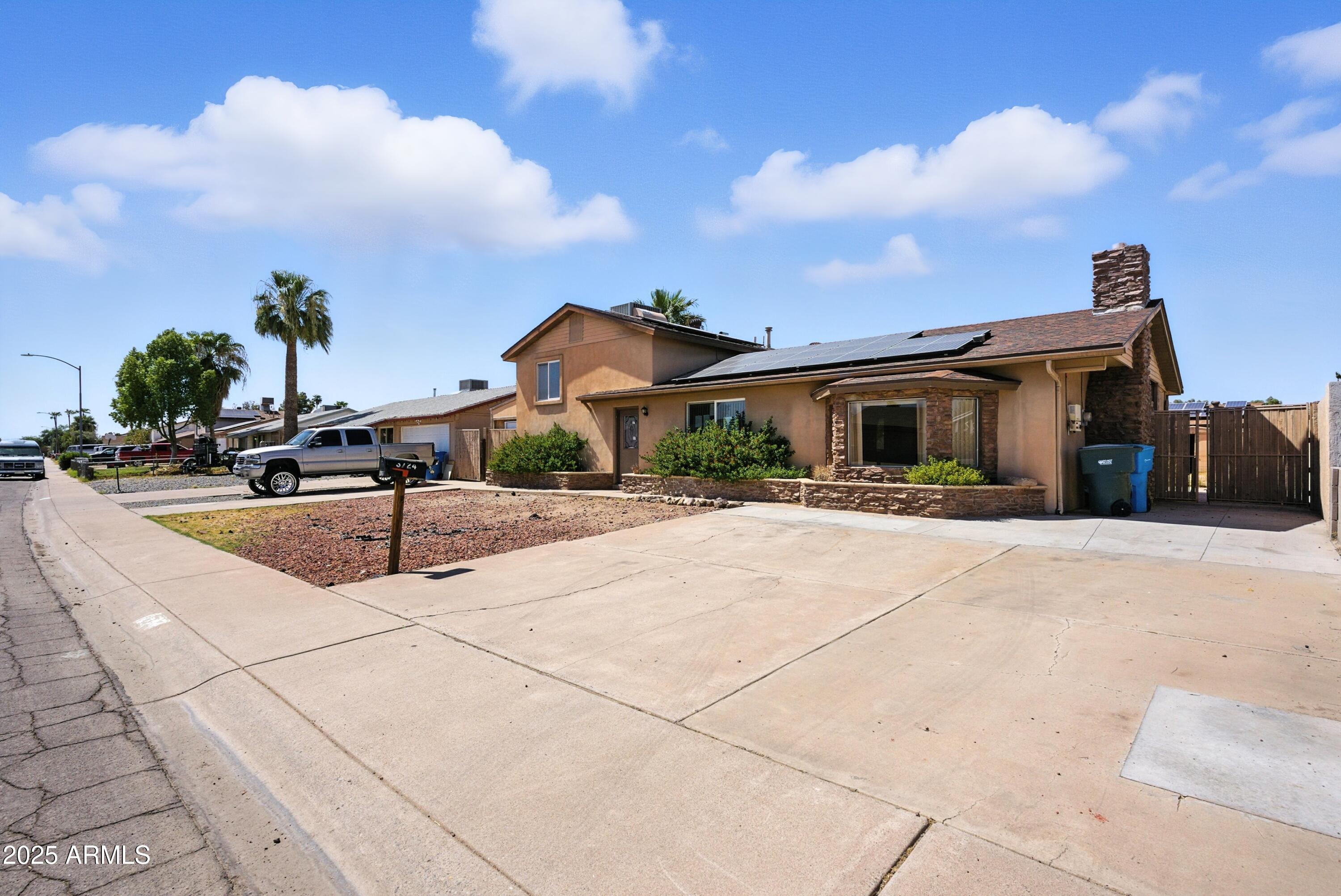 3724 West Bloomfield Road Phoenix, AZ 85029 - Photo 2 of 32 a front view of a house with a yard