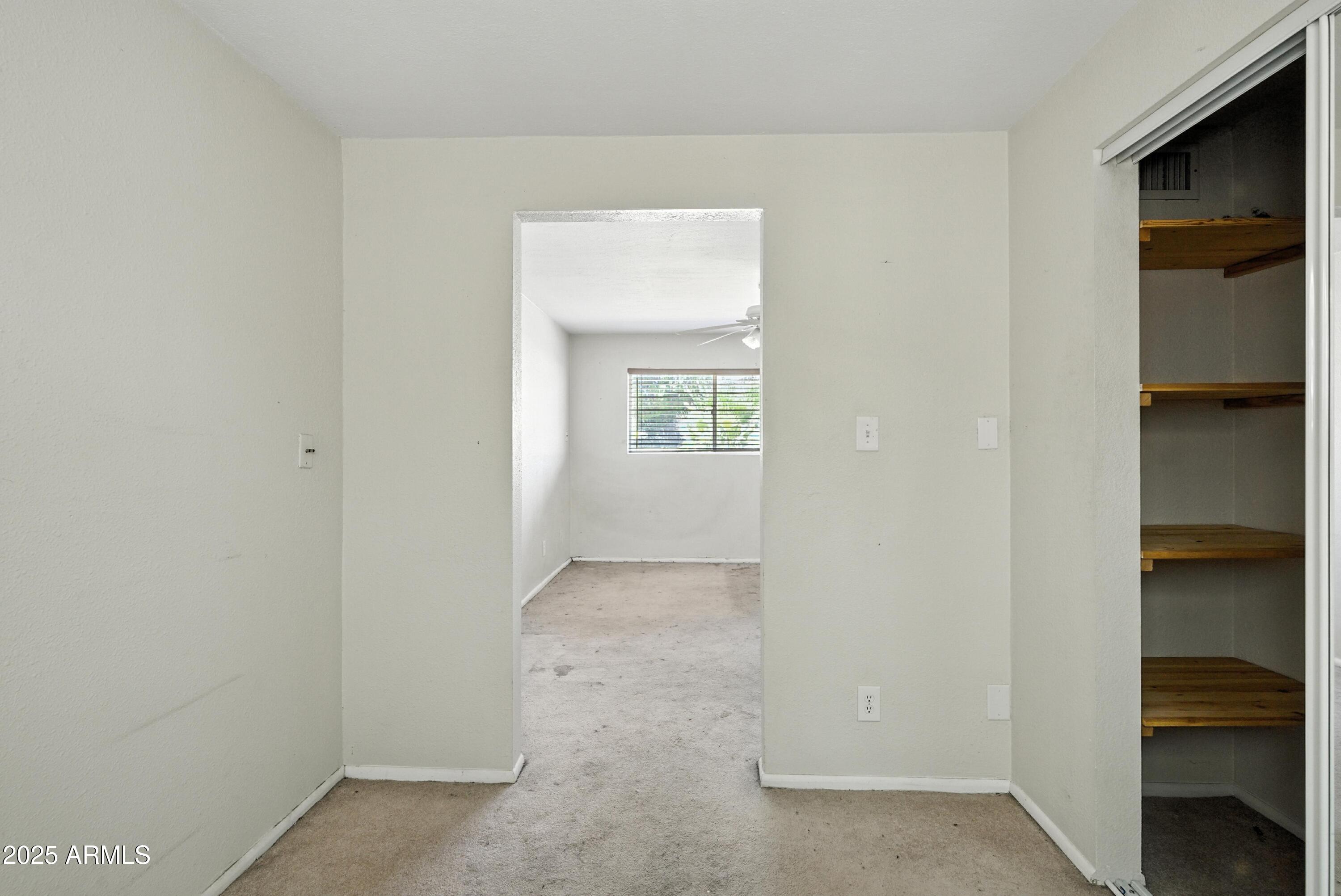 3724 West Bloomfield Road Phoenix, AZ 85029 - Photo 21 of 32 a view of an empty room with closet and a window