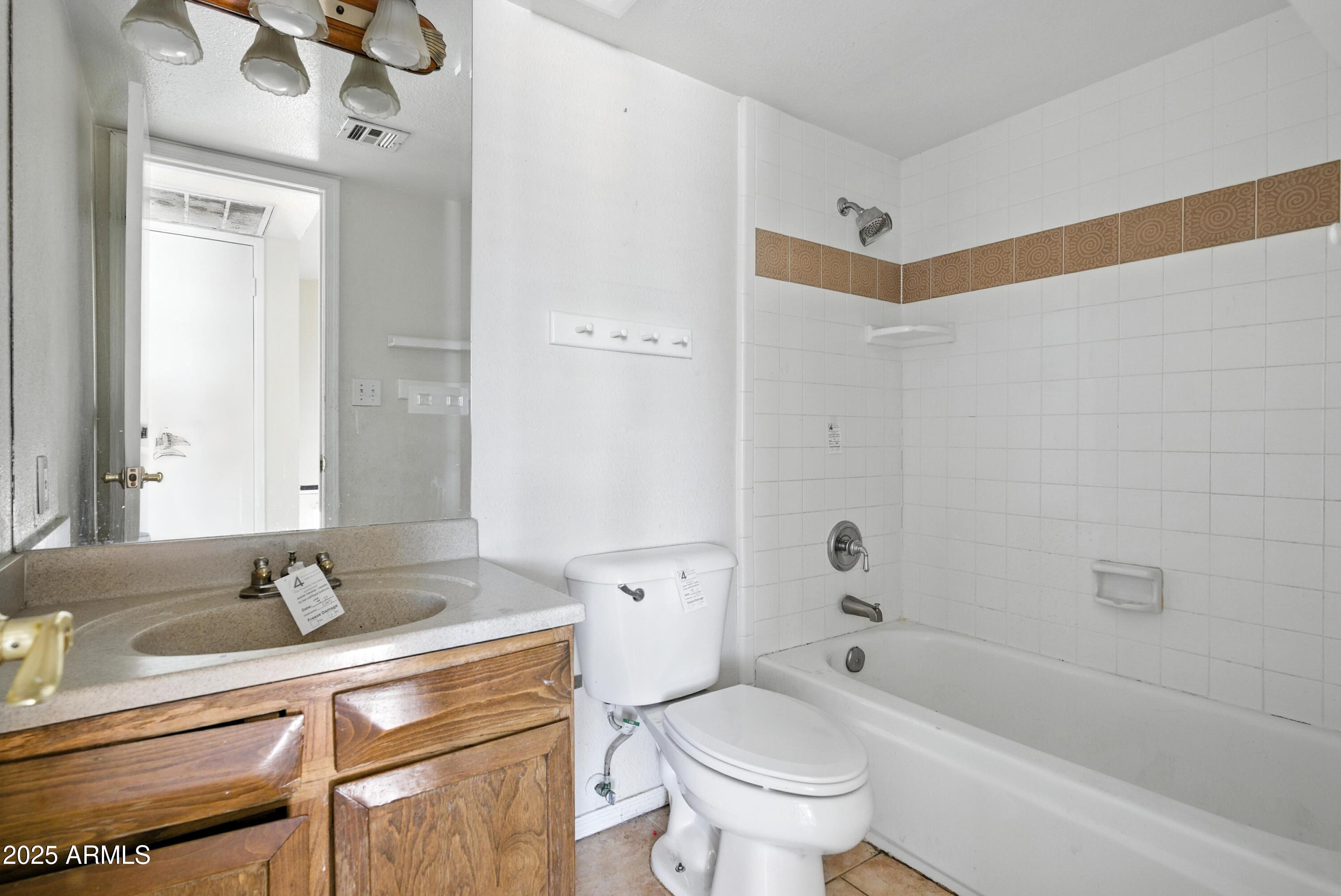3724 West Bloomfield Road Phoenix, AZ 85029 - Photo 22 of 32 a bathroom with a granite countertop sink a toilet and shower