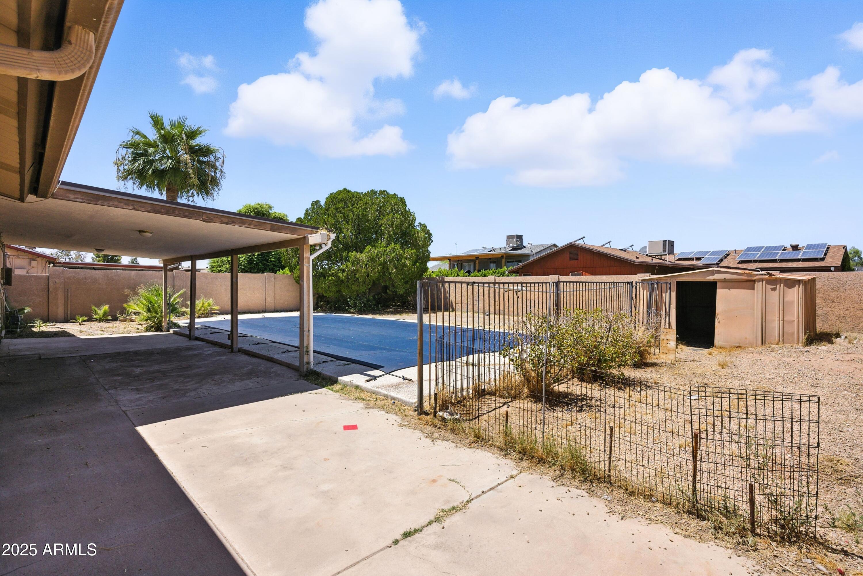 3724 West Bloomfield Road Phoenix, AZ 85029 - Photo 29 of 32 a view of a white house with a yard