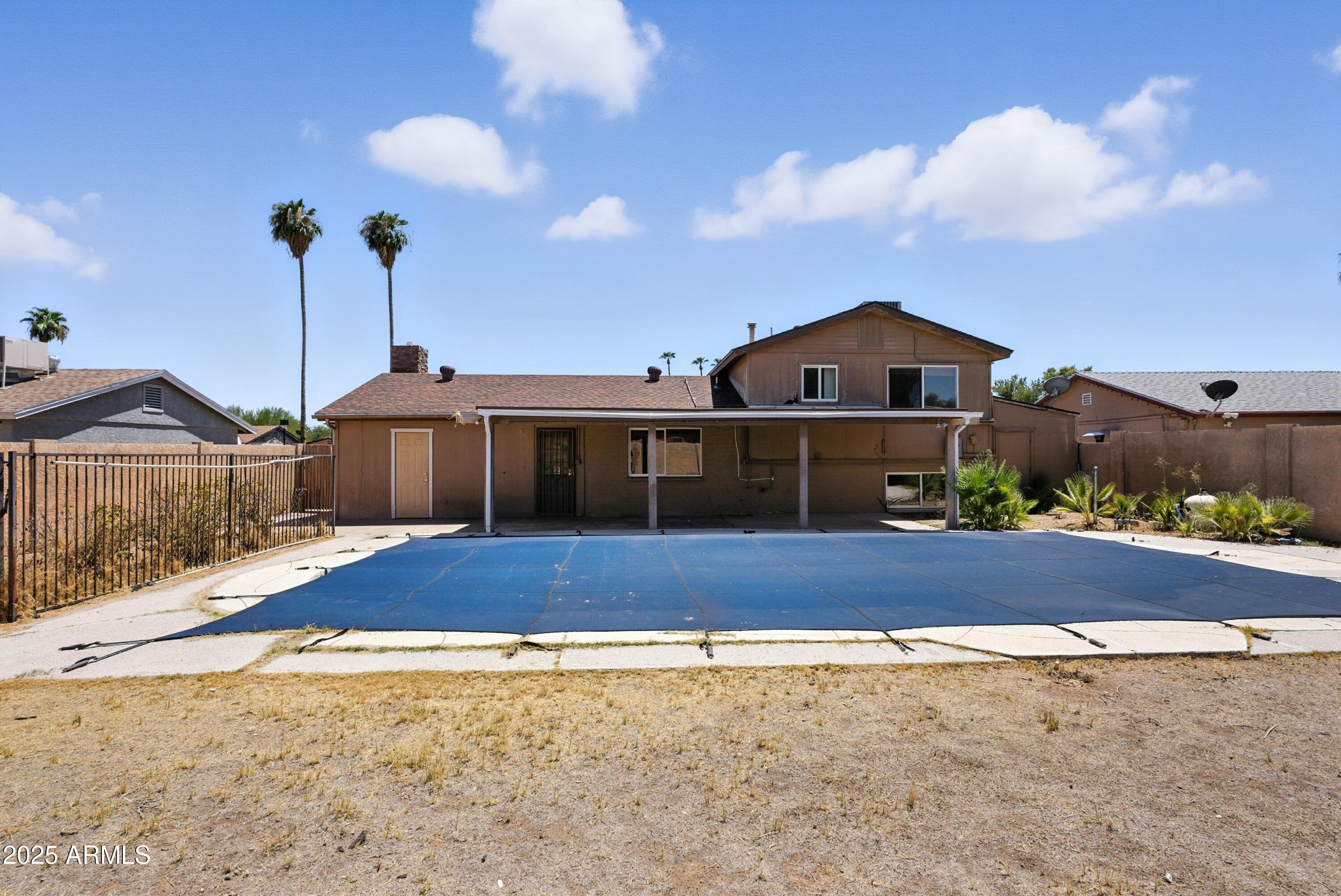 3724 West Bloomfield Road Phoenix, AZ 85029 - Photo 31 of 32 a front view of a house with a yard and garage