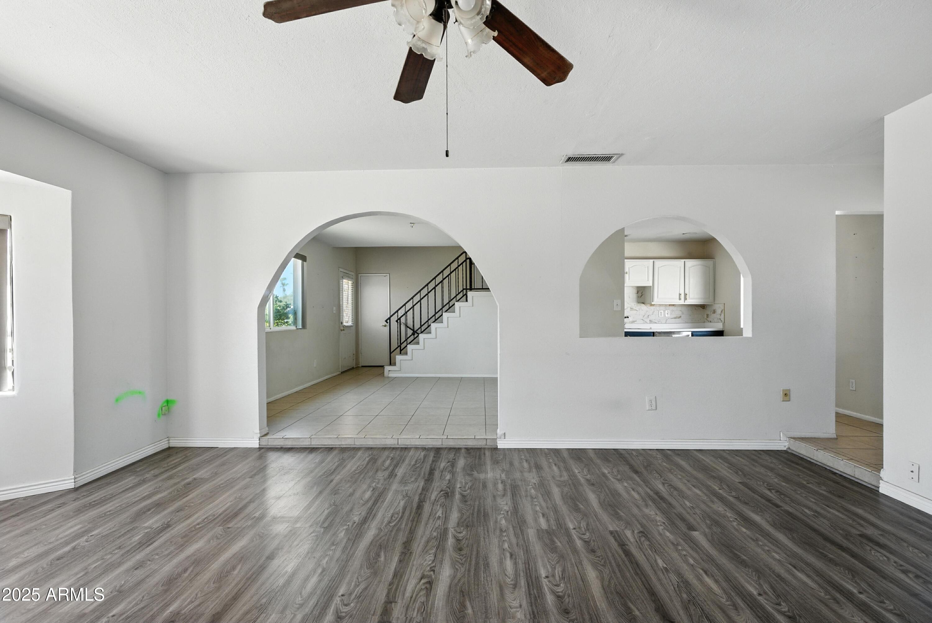 3724 West Bloomfield Road Phoenix, AZ 85029 - Photo 10 of 32 wooden floor in an empty room with a window
