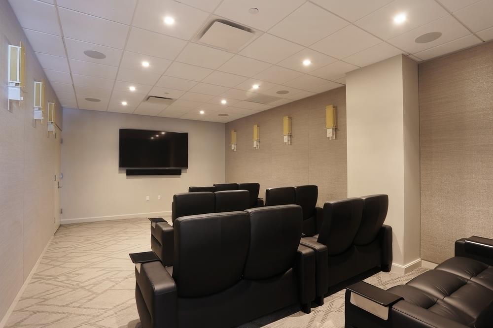 81 Fleet Place, Unit 11M Brooklyn, NY 11201 - Photo 7 of 10 a living room with furniture and a flat screen tv