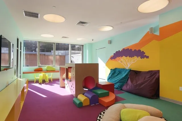 a living room with couches and pool dining table
