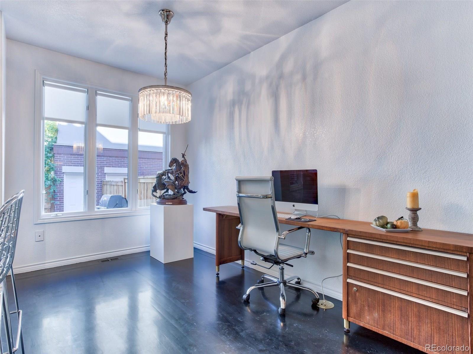 13 South Garfield Street Denver, CO 80209 - Photo 12 of 27 a workspace with furniture wooden floor and a chandelier