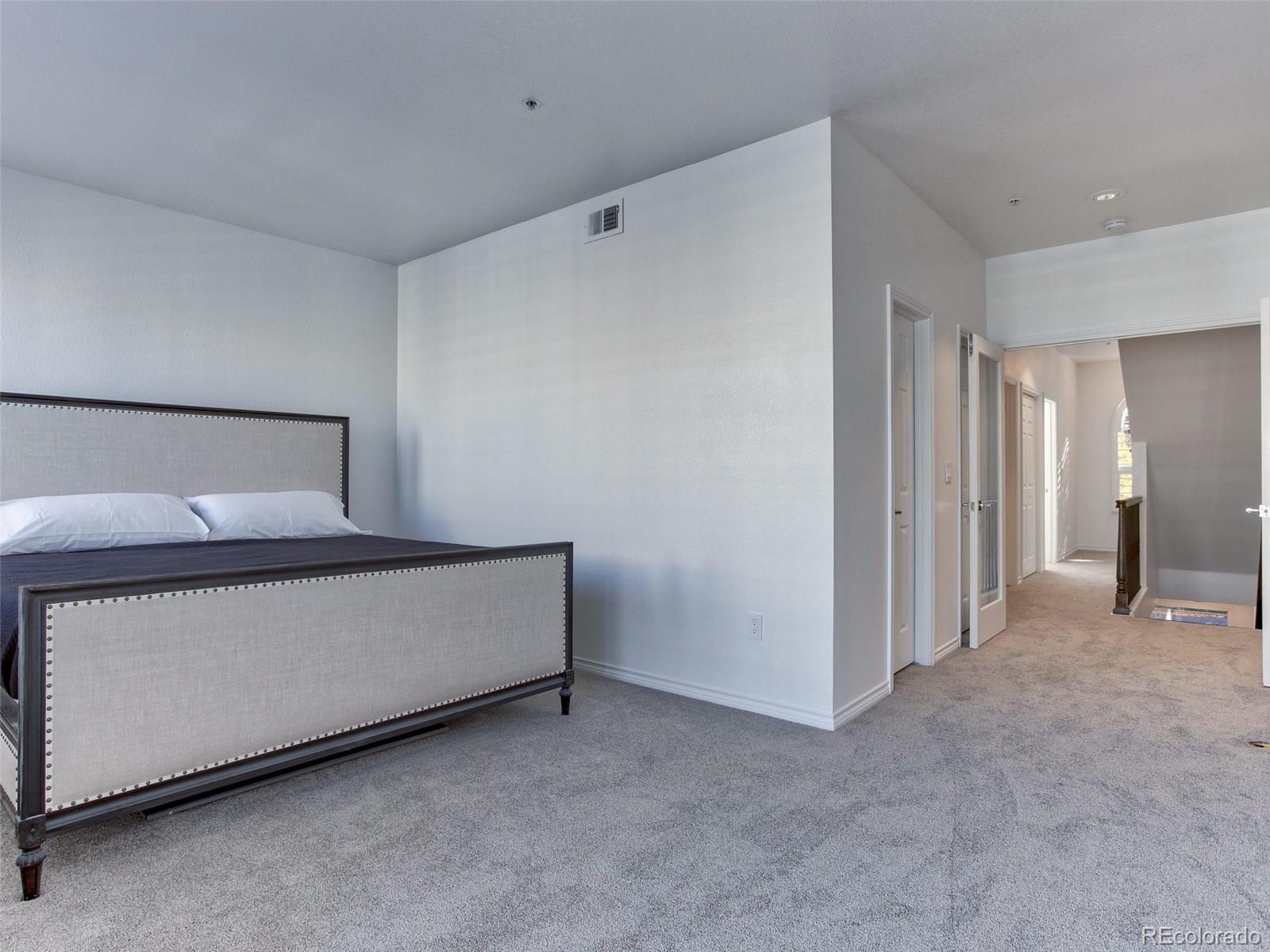 13 South Garfield Street Denver, CO 80209 - Photo 14 of 27 a room with a bed and a cabinet