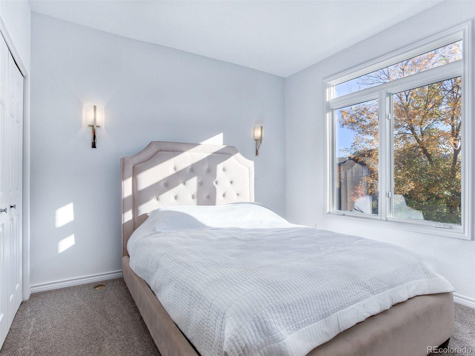 13 South Garfield Street Denver, CO 80209 - Photo 16 of 27 a bedroom with a large bed and a large window