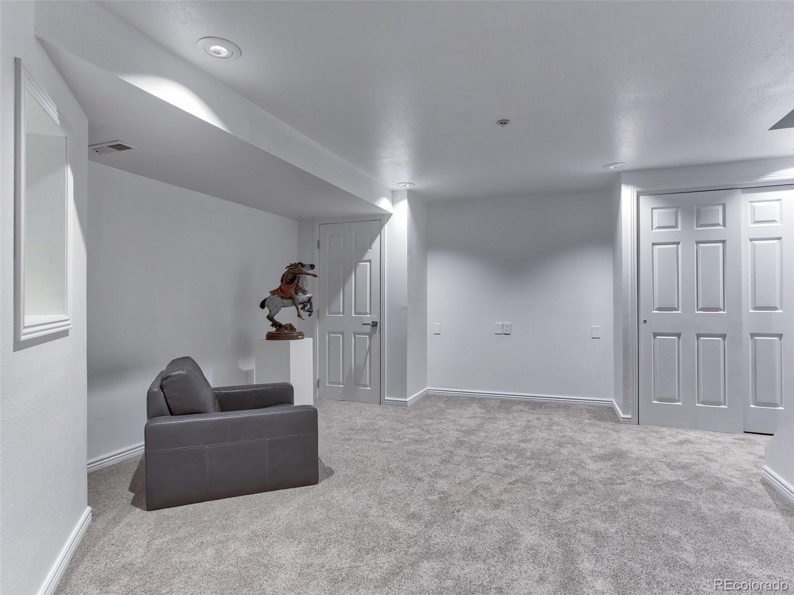13 South Garfield Street Denver, CO 80209 - Photo 21 of 27 a living room with furniture and a potted plant