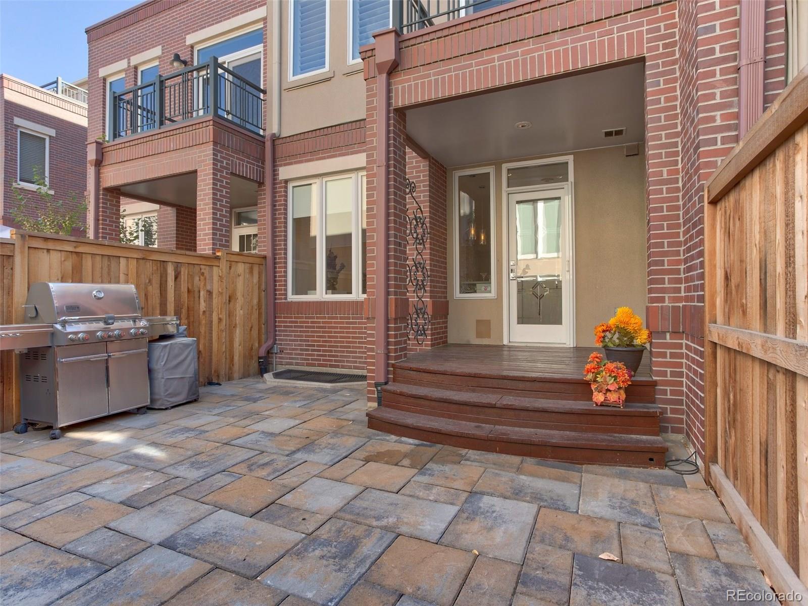 13 South Garfield Street Denver, CO 80209 - Photo 24 of 27 a view of a house with a large window and a yard