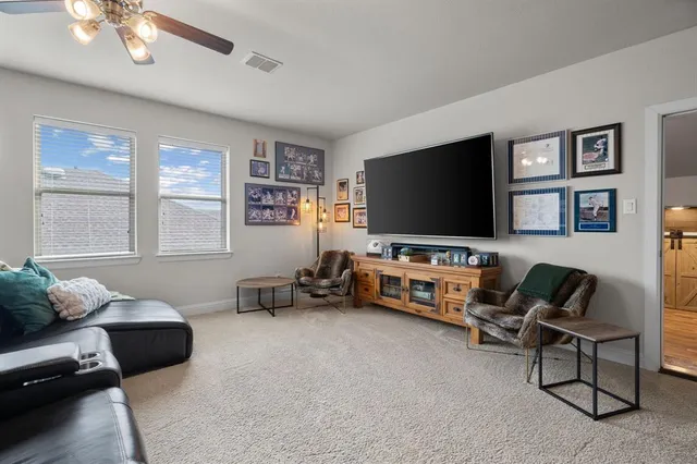 a bed room with a bed and a chair