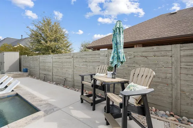 a view of a house with backyard porch and sitting area