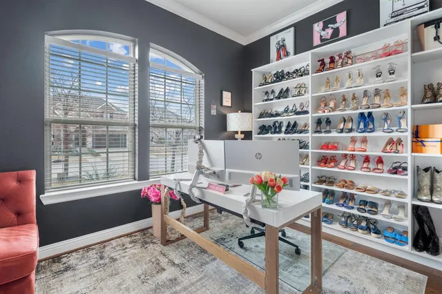 a living room with furniture cabinets and book shelf