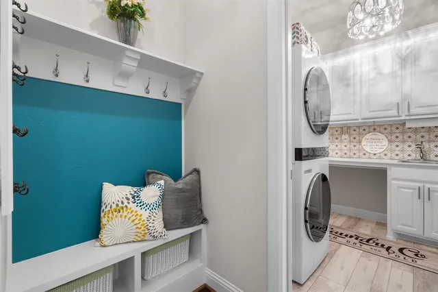 a view of storage and utility room with washer and dryer