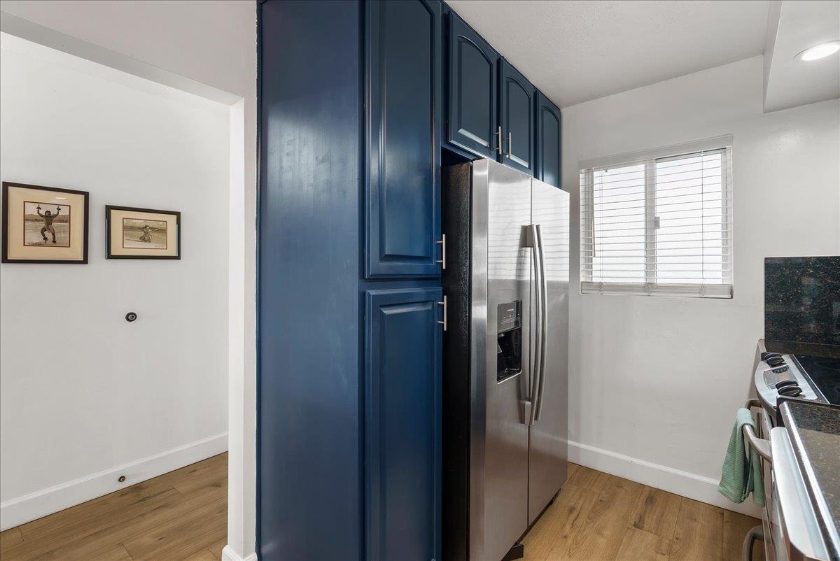 760 South Kihei Road, Unit 405 Kihei, HI 96753 - Photo 12 of 39 a kitchen with stainless steel appliances granite countertop a refrigerator and a window