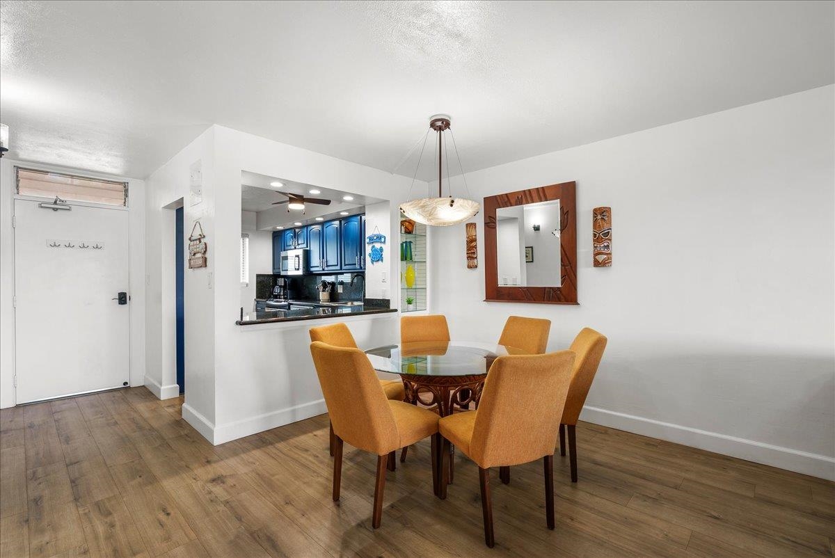 760 South Kihei Road, Unit 405 Kihei, HI 96753 - Photo 15 of 39 a view of a dining room with furniture window and wooden floor