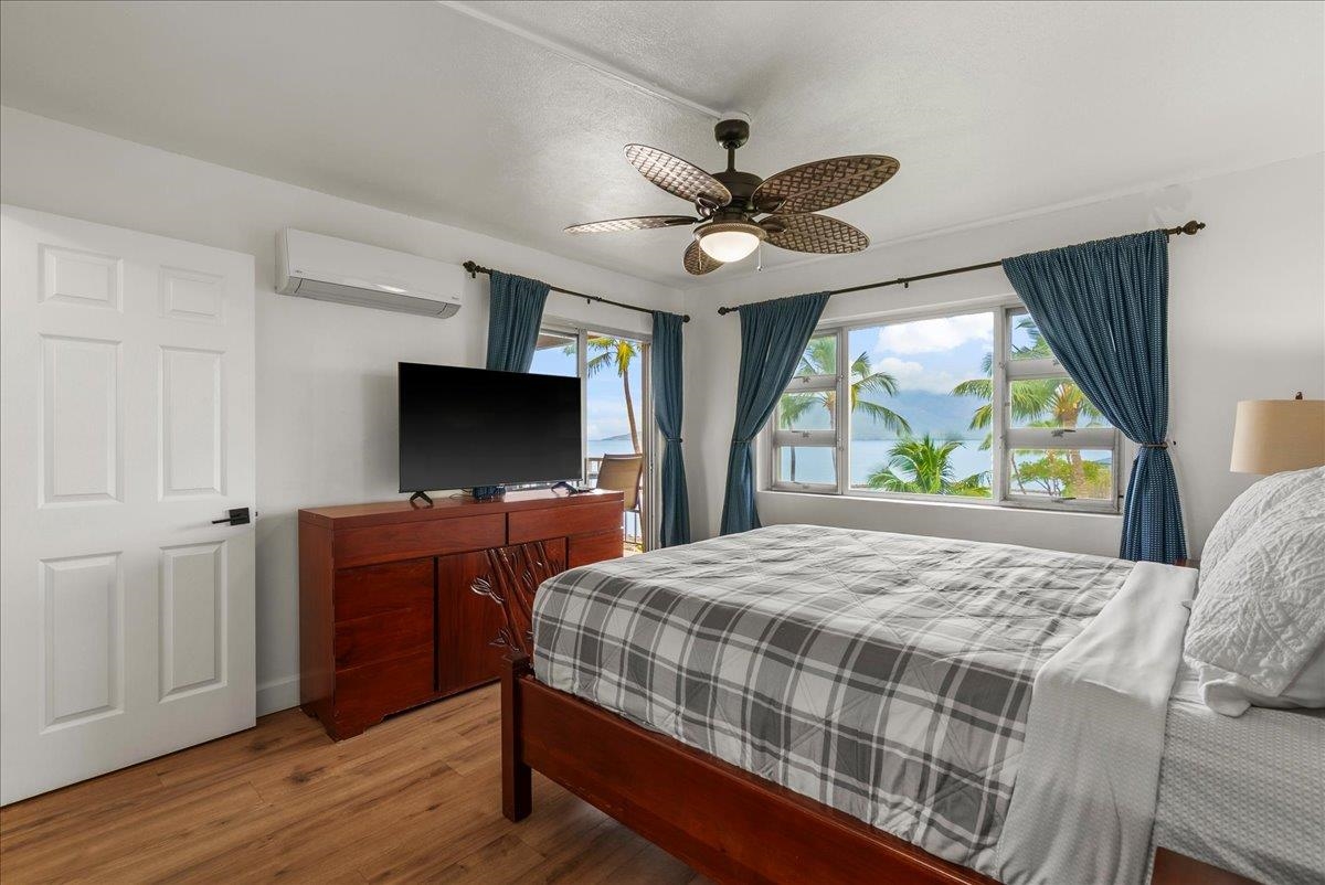 760 South Kihei Road, Unit 405 Kihei, HI 96753 - Photo 16 of 39 a bedroom with a bed and a flat screen tv