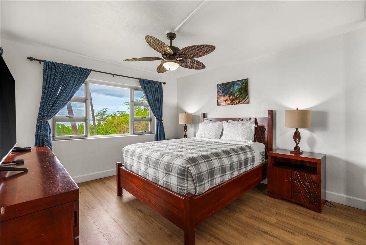 760 South Kihei Road, Unit 405 Kihei, HI 96753 - Photo 17 of 39 a bedroom with a bed and a desk