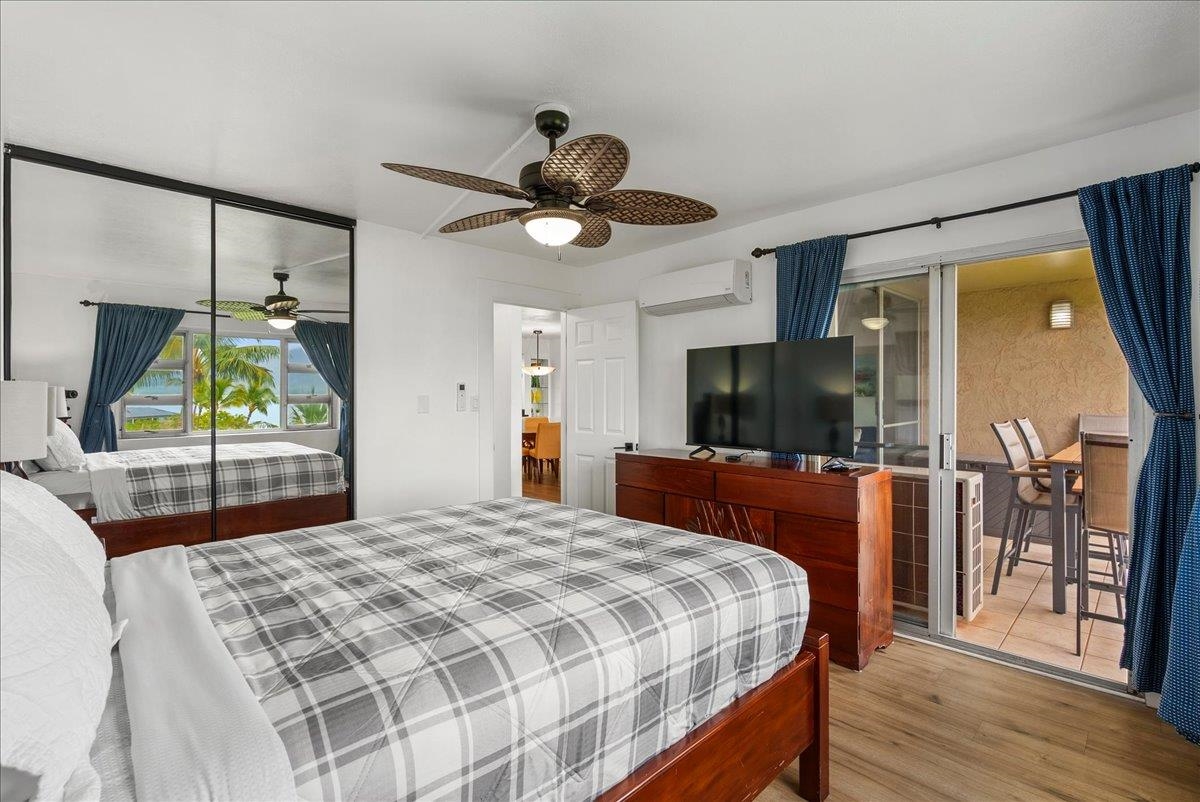 760 South Kihei Road, Unit 405 Kihei, HI 96753 - Photo 19 of 39 a bedroom with a bed and a flat screen tv
